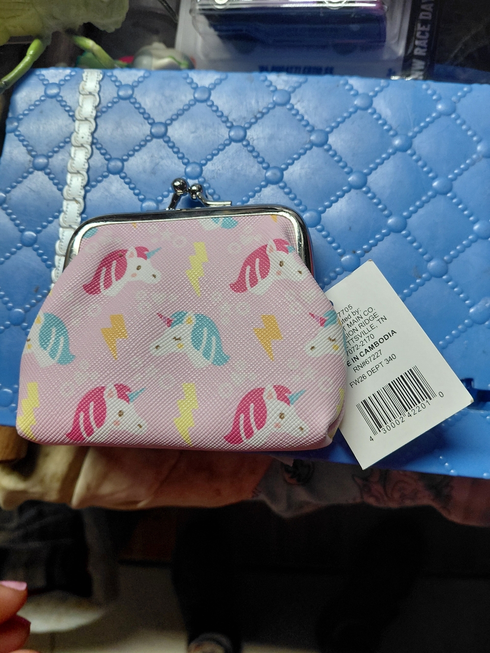 pink kiss-lock coin purse featuring a playful unicorn and yellow lightning bolt